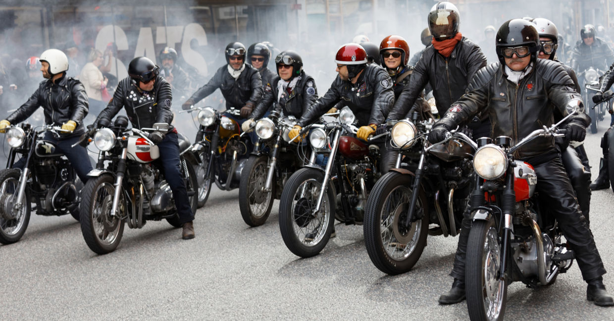 Members of motorcycle clubs ride together in large groups showing off their bikes Members of motorcycle clubs ride together in large groups showing off their bikes