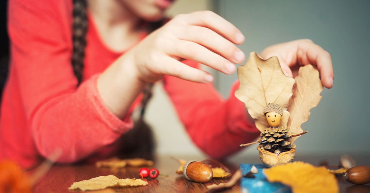 Child painting pinecones Child painting pinecones