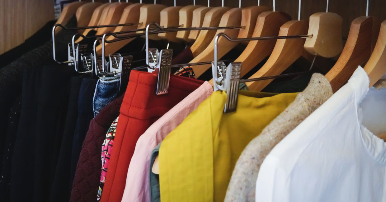Woman organizing her closet Woman organizing her closet