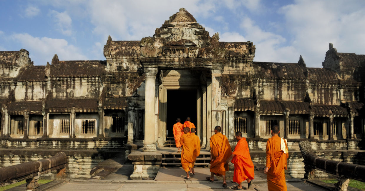 Buddhist monks at Angkor Wat. Ancient Khmer architecture, Ta Prohm temple ruins hidden in jungles. Popular travel destination at Siem Reap, Cambodia Buddhist monks at Angkor Wat. Ancient Khmer architecture, Ta Prohm temple ruins hidden in jungles. Popular travel destination at Siem Reap, Cambodia