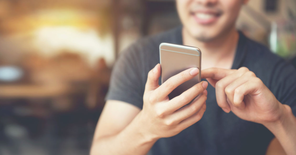Man intrigued by his smartphone