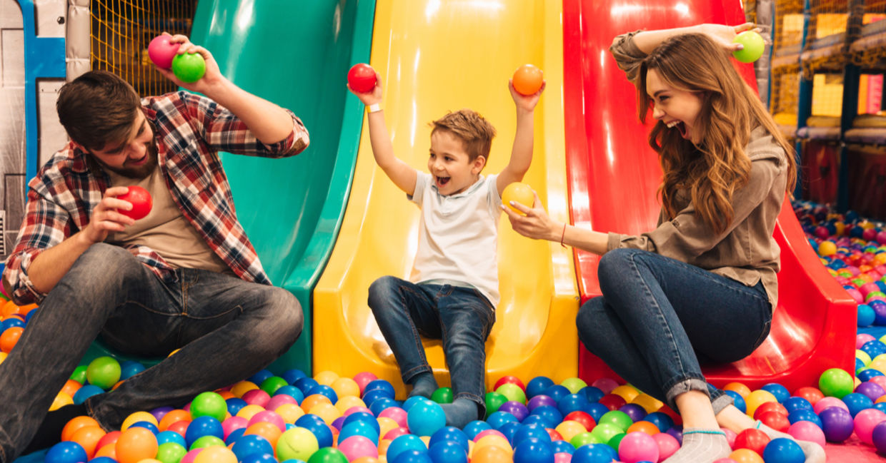 Parents playing with their child. Parents playing with their child.