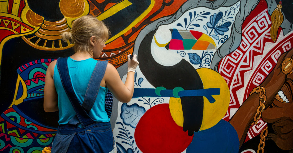 Woman painting street art. Woman painting street art.