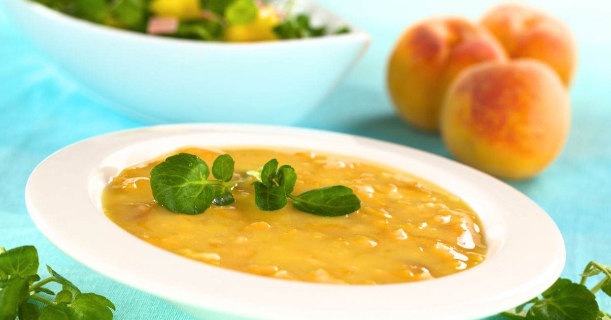 Cold peach soup garnished with watercress. Cold peach soup garnished with watercress.