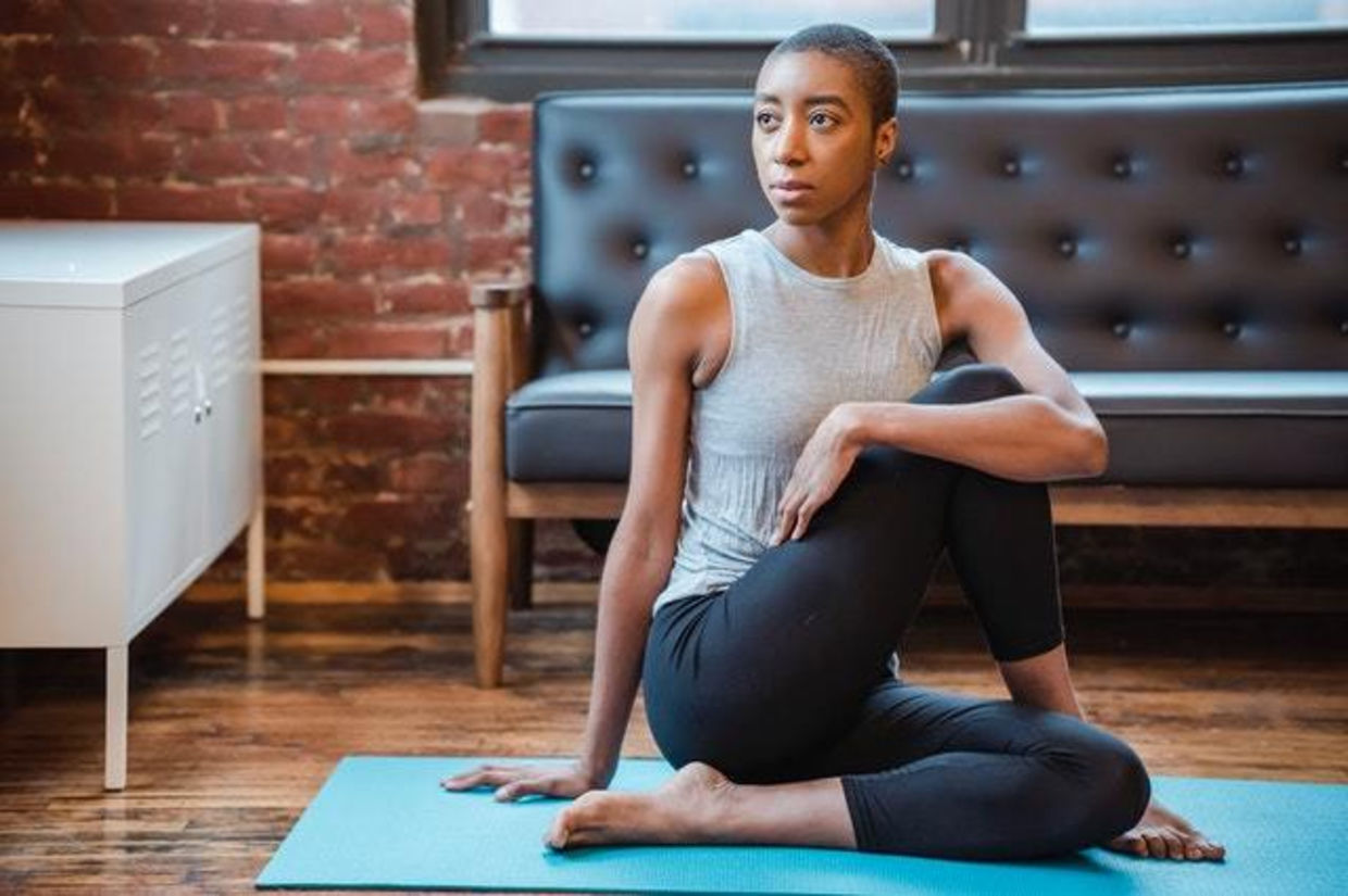 Woman doing the kemetic yoga pose of Isis. Woman doing the kemetic yoga pose of Isis.