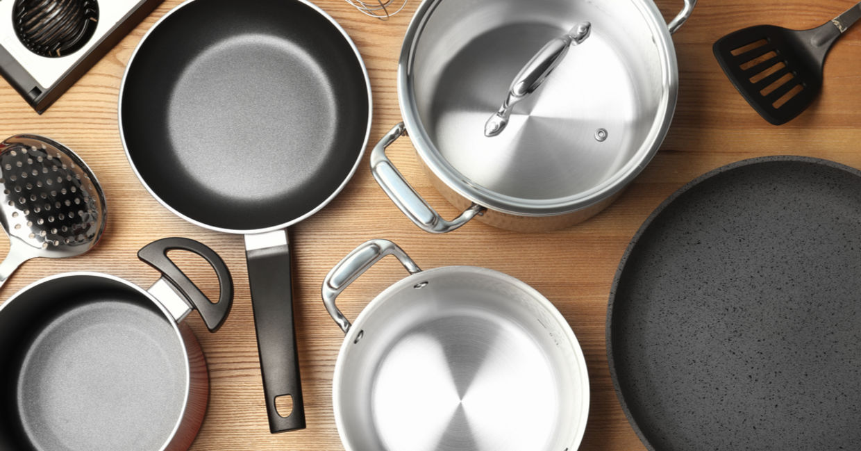 A selection of kitchen cookware including pots, pans, and utensils. A selection of kitchen cookware including pots, pans, and utensils.