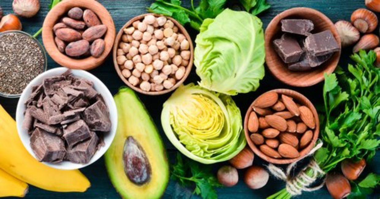 Foods that are rich in magnesium, including dark chocolate, nuts, and avocado. Foods that are rich in magnesium, including dark chocolate, nuts, and avocado.