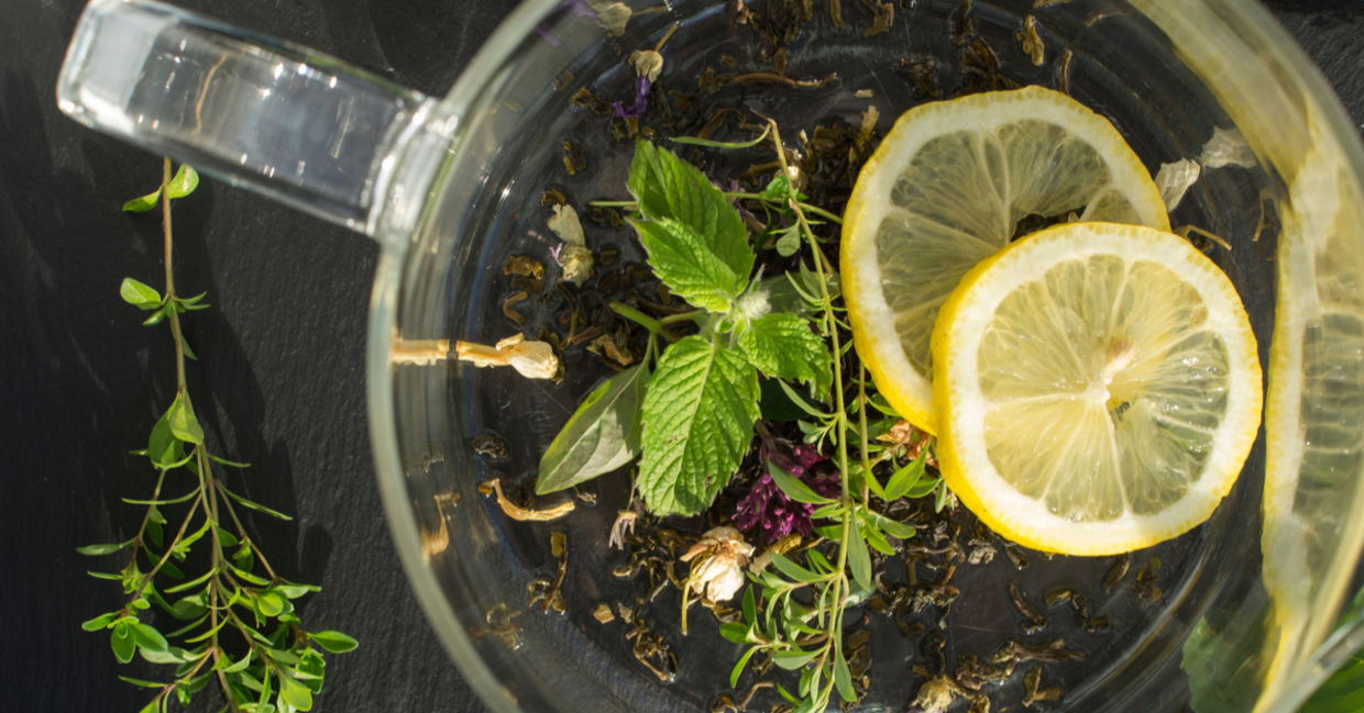 A calming mix of lemon balm and lemon slices in a teacup. A calming mix of lemon balm and lemon slices in a teacup.