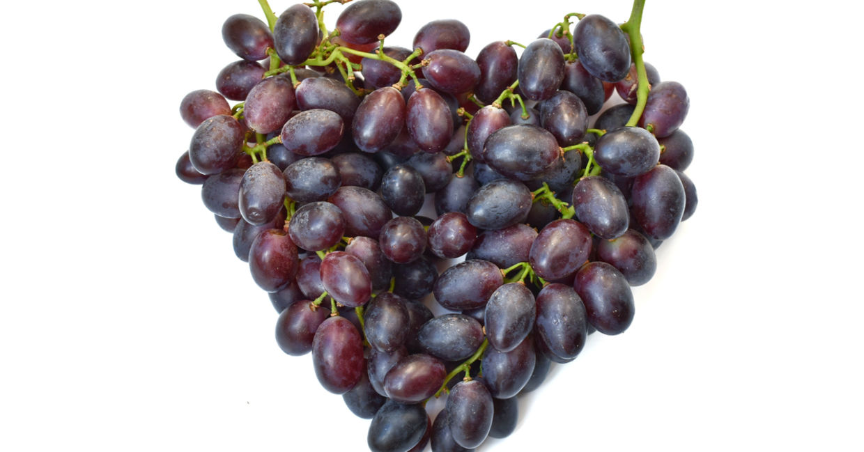 Bunches of purple grapes in the shape of a heart. Bunches of purple grapes in the shape of a heart.