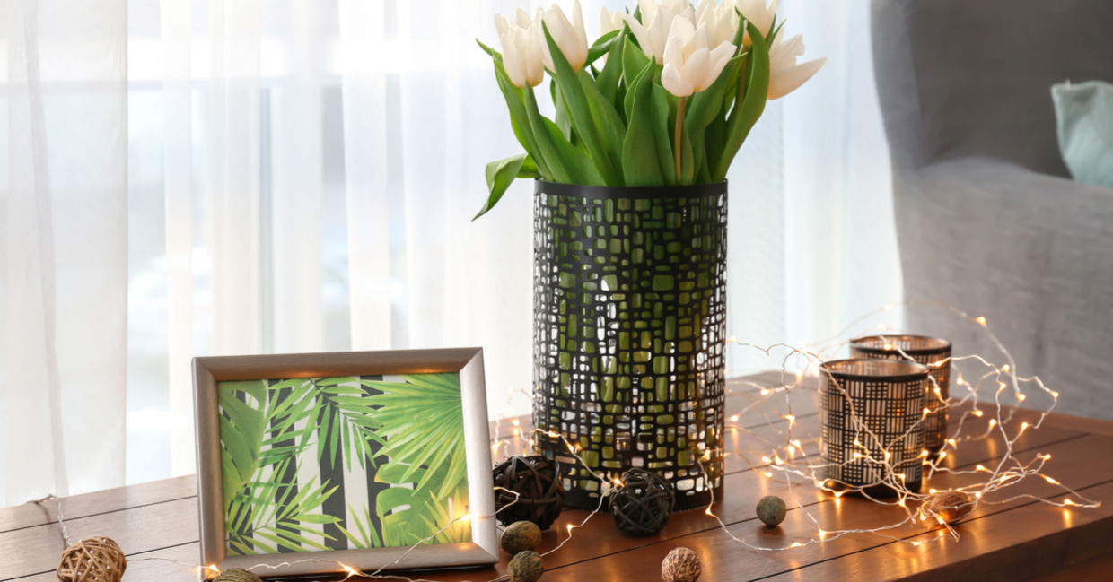 A bouquet of tulips beside gentle, twinkling fairy lights create a gezellig ambiance. A bouquet of tulips beside gentle, twinkling fairy lights create a gezellig ambiance.