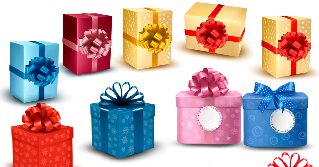 An assortment of upcycled gift boxes with bows. An assortment of upcycled gift boxes with bows.