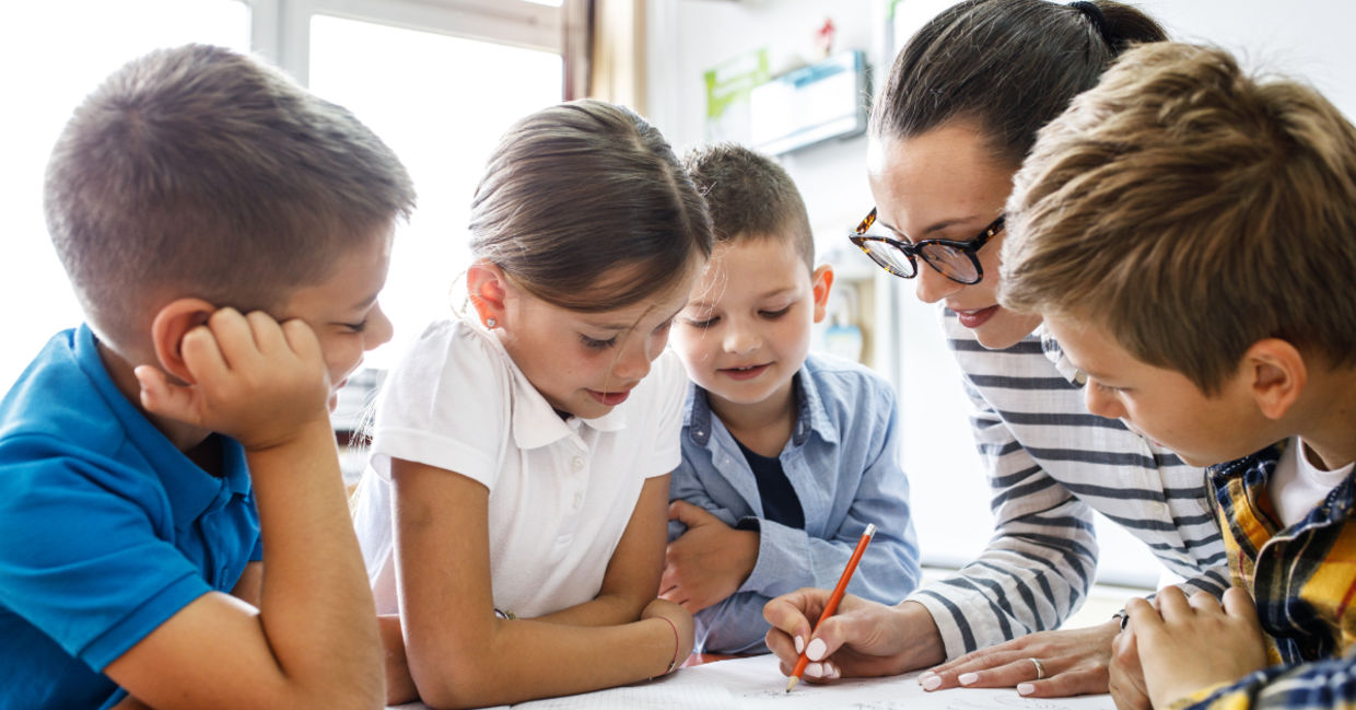 A teacher with her students. A teacher with her students.