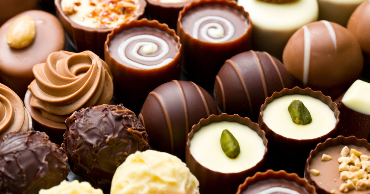 A box of assorted chocolate pralines. A box of assorted chocolate pralines.