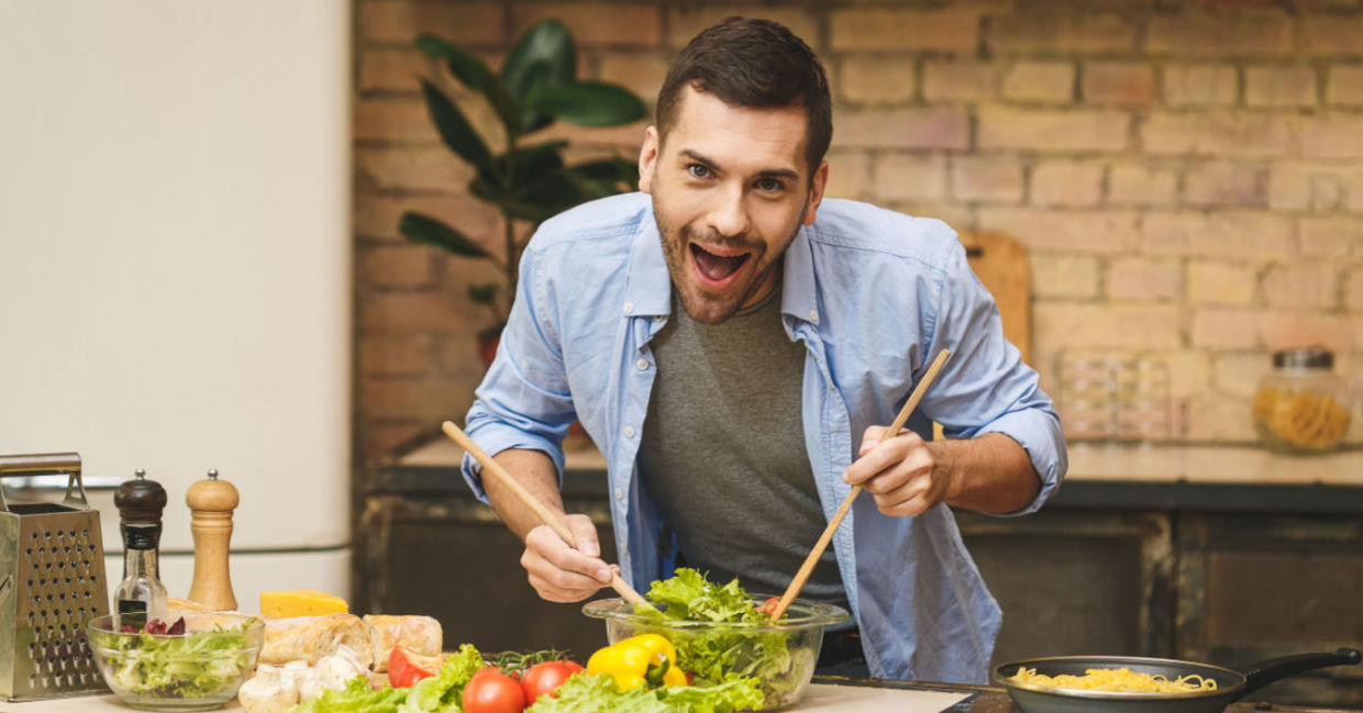 An enthusiastic chef cooks in the kitchen. An enthusiastic chef cooks in the kitchen.