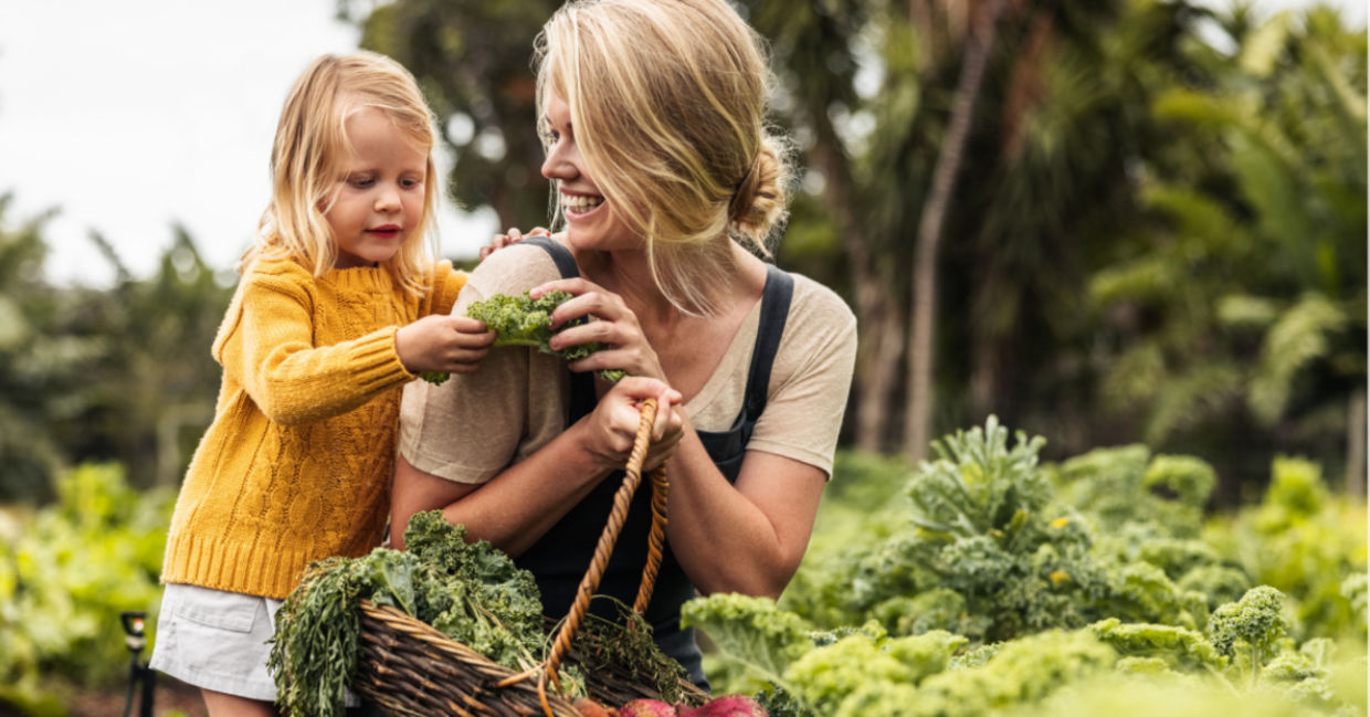 A mother and child in an organic garden. A mother and child in an organic garden.