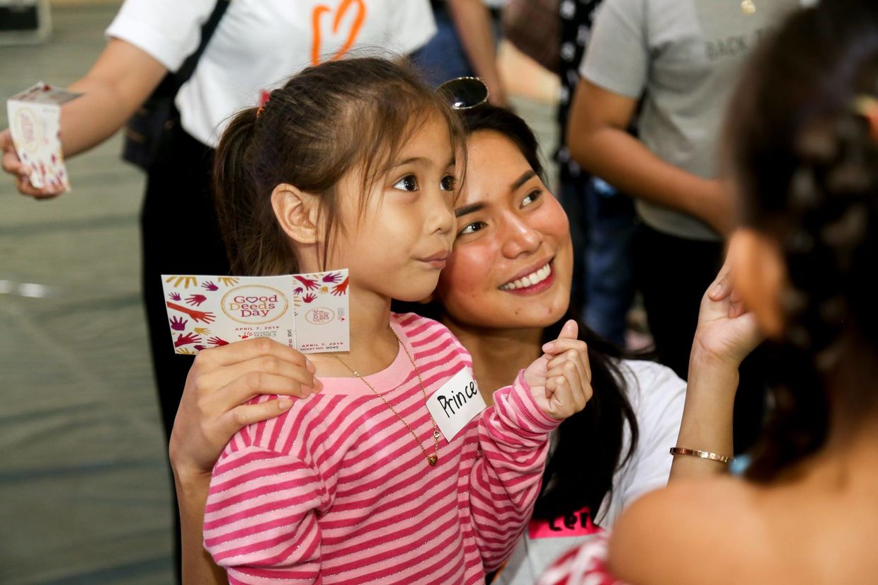 Celebrating at the Good Deeds Day carnival in Manila Celebrating at the Good Deeds Day carnival in Manila