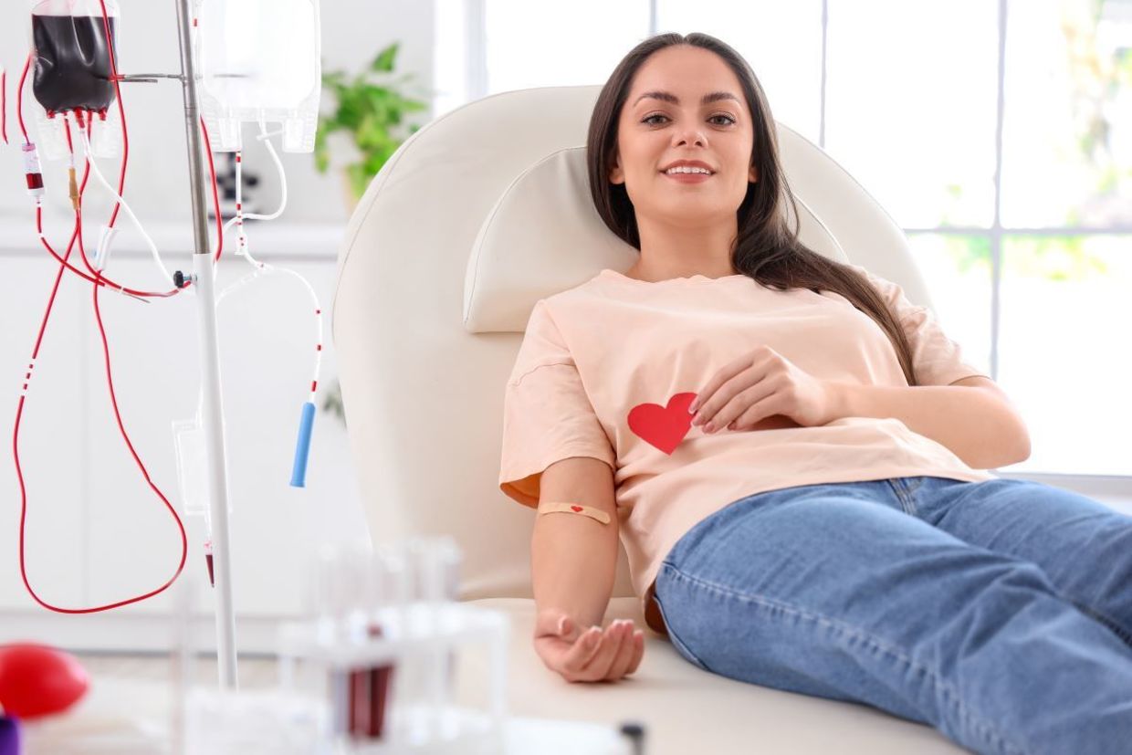 Woman donating blood. Woman donating blood.