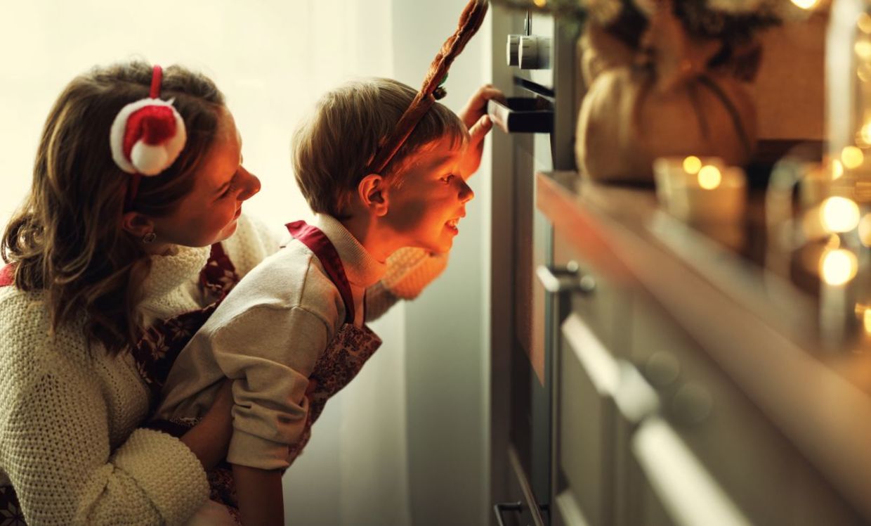 Mother and son cooking a festive meal. Mother and son cooking a festive meal.