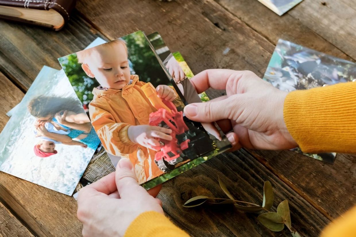 Looking at photographs brings back cherished memories. Looking at photographs brings back cherished memories.